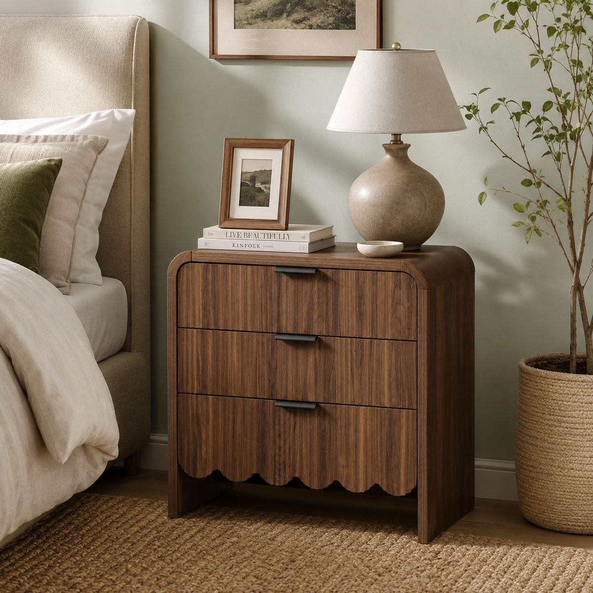 Fluted walnut nightstand with scalloped wave base in a bedroom