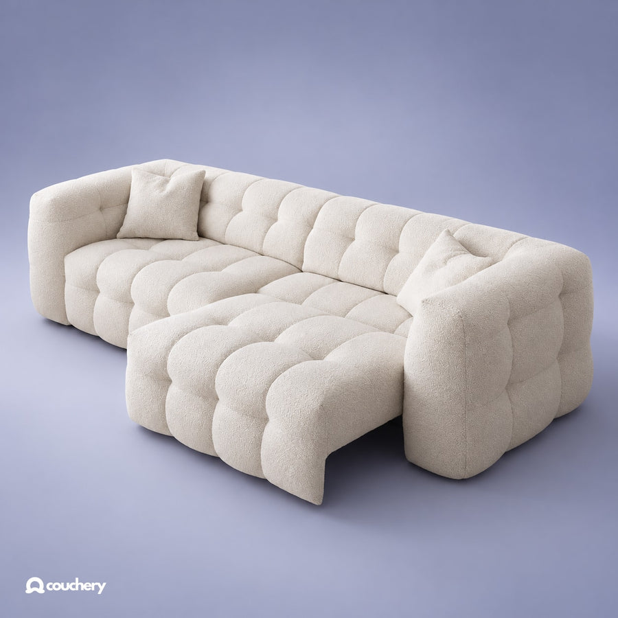 MallowNest electrical extendable sofa bed in cream bouclé — centred square studio view with blue-grey background