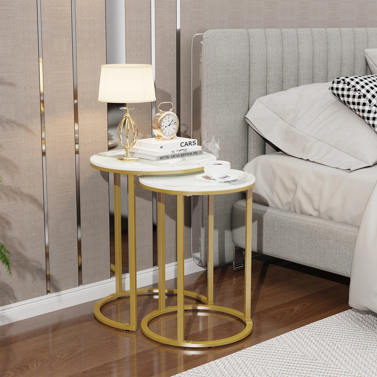 Nesting side tables beside a bed