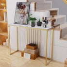 Gold console table by a staircase