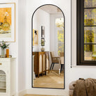 Arched floor mirror in a living room