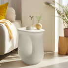 U-shaped side table next to a sofa
