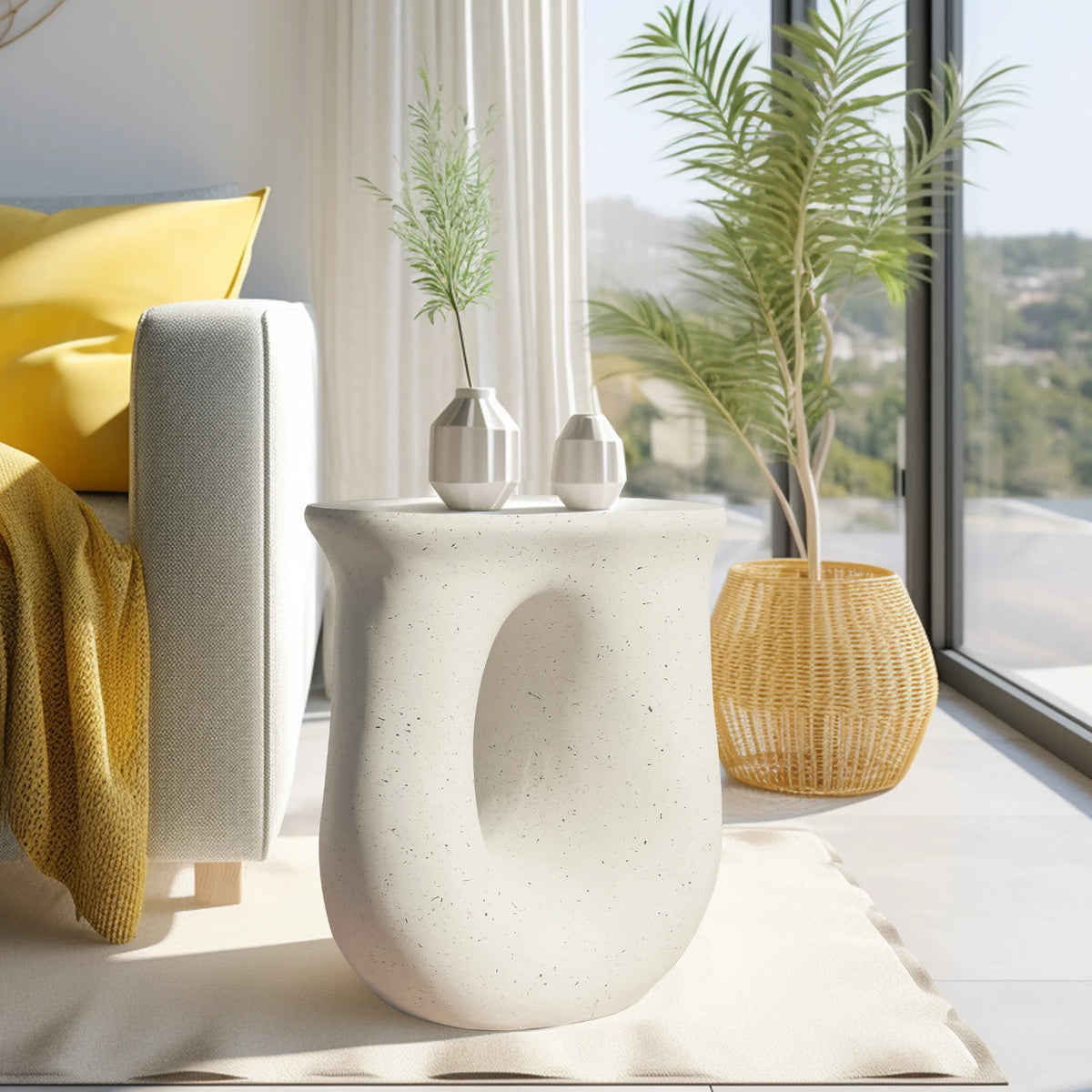U-shaped concrete side table in a sunny living room