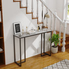 Stone top console table by a staircase