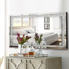 Crushed crystal rectangle wall mirror above a sideboard