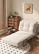 International folding sleeper chair extended as an ivory corduroy chaise lounge